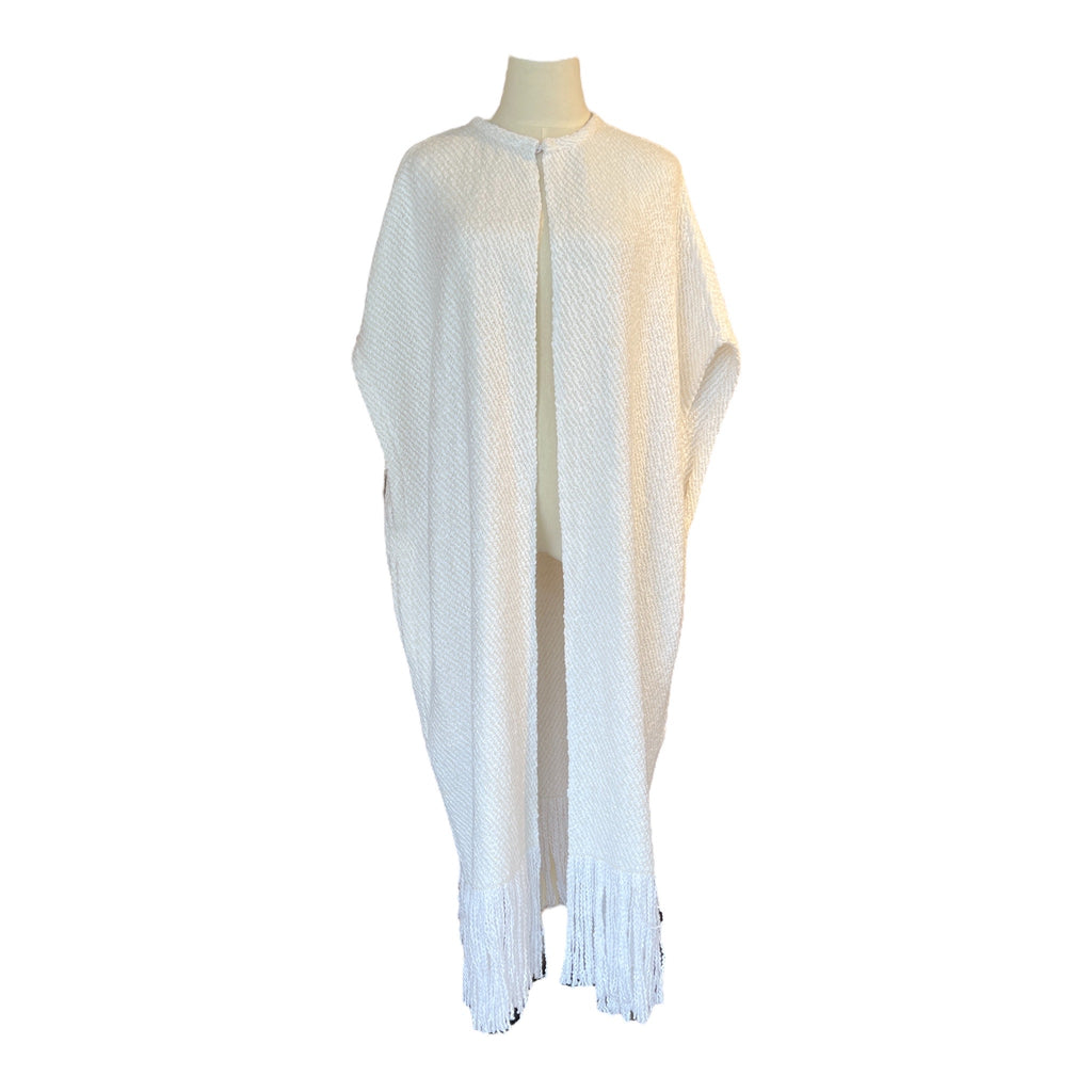 Long white hand woven cloak by WEHVE. One size, pockets, fringe, 60% cotton, 40% merino wool.